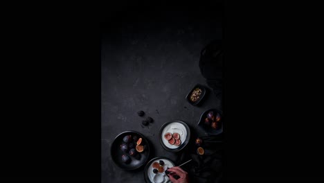 Unrecognizable-person-preparing-breakfast-in-dark-studio