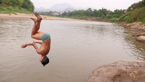 children swimming in a river