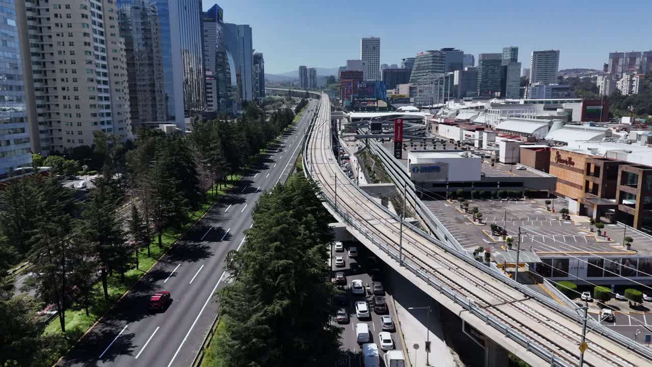 Aerial View of Modern City with Light Rail and Shopping Mall