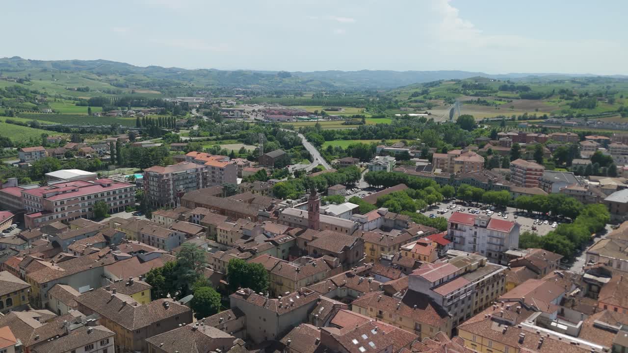 Nizza Monferrato, UNESCO site, Asti, Piedmont, Italy. 4k aerial view of the city. Langhe-Roero and Monferrato. Flying forward above the city and green field.