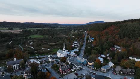 Stowe-Community-Church-With-View-Of-Mountain-Forest-In-Autumn-Colors-At-Sunset