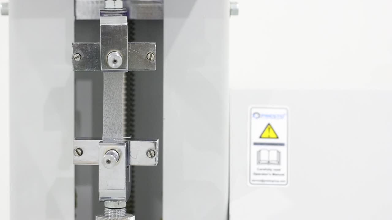 Close view of tensile testing of EVA plastic film for strength