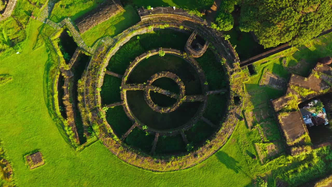 Drone ascends over Baluarte de San Diego at sunrise in Intramuros Manila
