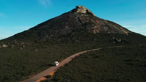 aerial of a van driving to frenchman peak in cape legrand national park on a sunny morning near esperane, western australia