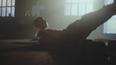 man doing crunches in gym
