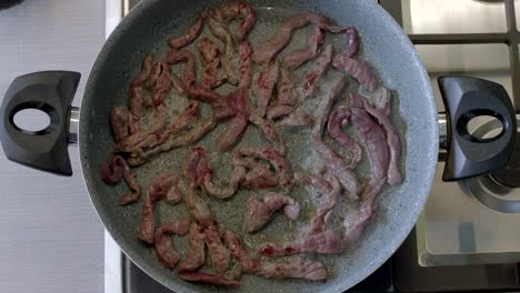 meats are frying in the pan