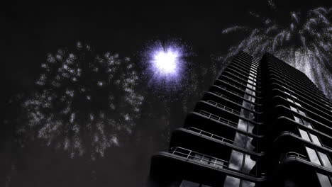 animación de un moderno bloque de torre con navidad blanca y fuegos artificiales de año nuevo explotando en el cielo nocturno