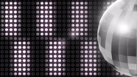 Animation-of-rotating-disco-ball-and-white-lights-at-christmas-and-new-year-celebration