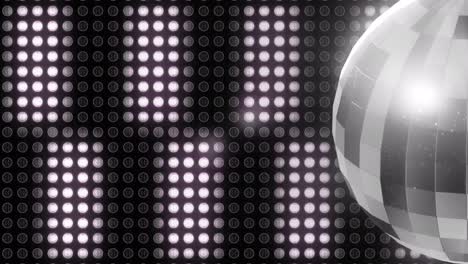 animación de bola de discoteca giratoria y luces blancas en la celebración de navidad y año nuevo