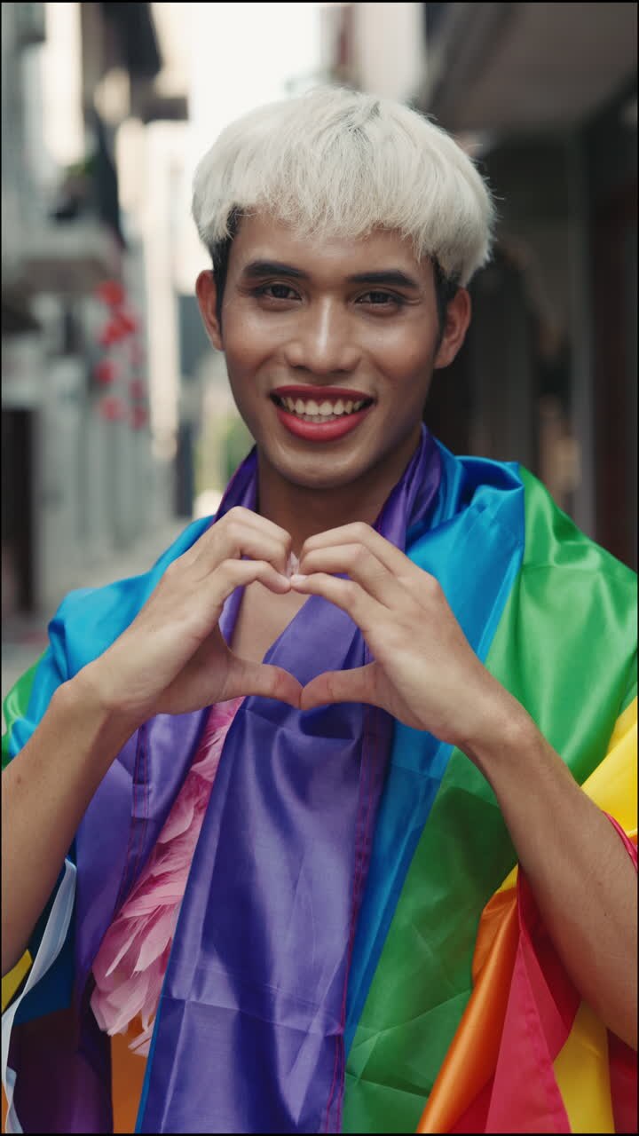 Happy person showing support for LGBTQ+ community.