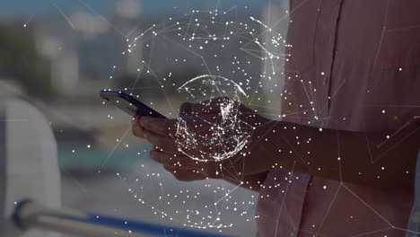 animation of network of connections with globe over caucasian man using smartphone