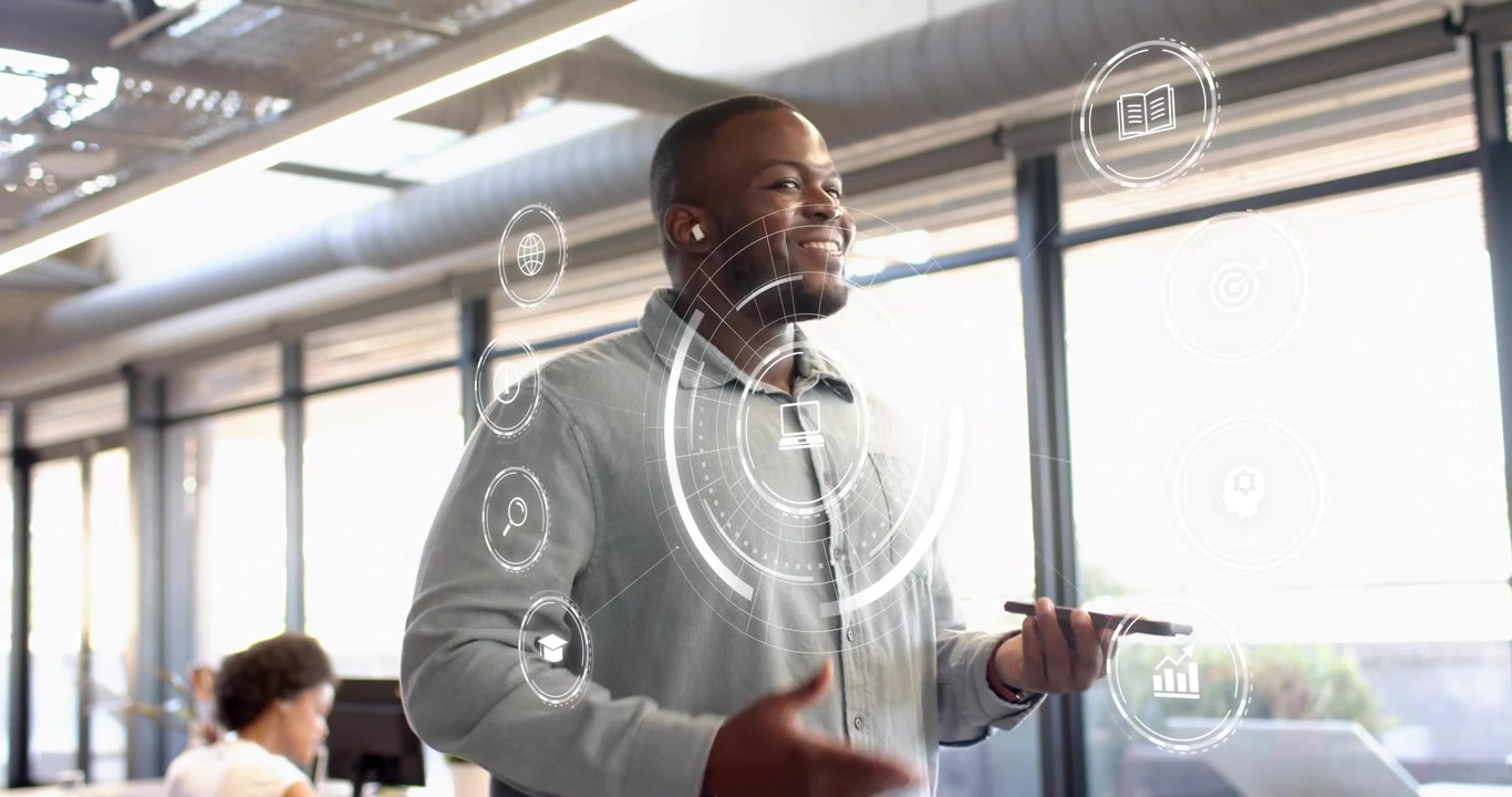 man entering tech office activating holographic torso graphics and explaining data concepts to peer