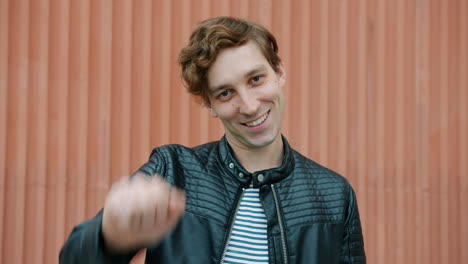 smiling man waving