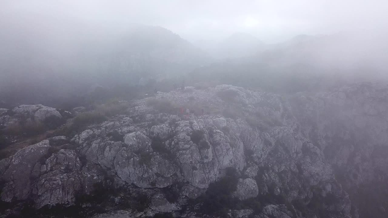 Aerial view through the clouds towards Puig Gros summit, Mallorca, Spain