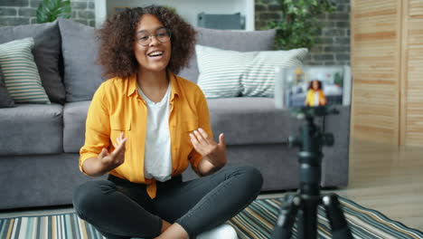 woman vlogging in living room