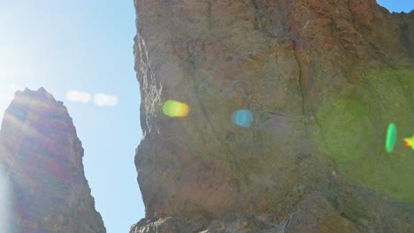 Rock-formation-in-desert,-vivid-shot-with-lens-flare