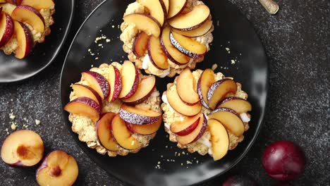 delicious homemade mini tarts with fresh sliced plum fruit