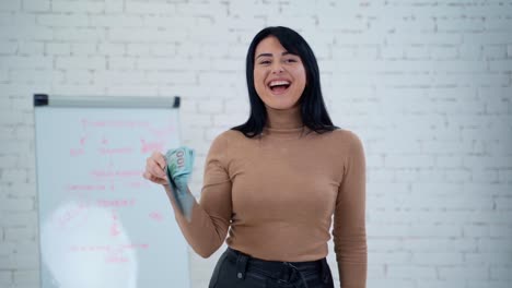 girl holding money. business woman holding stack of money