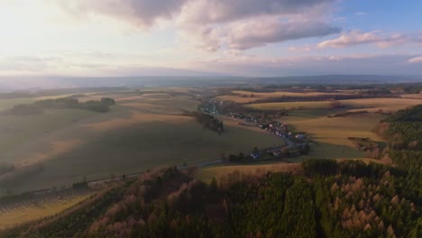 a small village in the middle of fields and forests