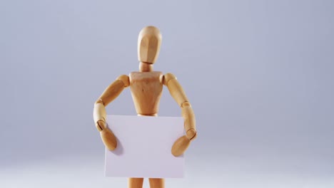 Figurine-holding-blank-placard