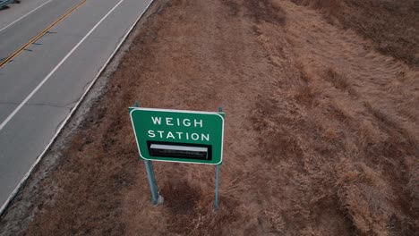 crane-shot-Wigh-Station-scale-road-sign-that-indicates-is-open