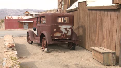 an old car sits in the ghost town of garlock california