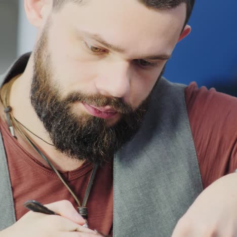 Barber-Concentrating-On-Client's-Hair