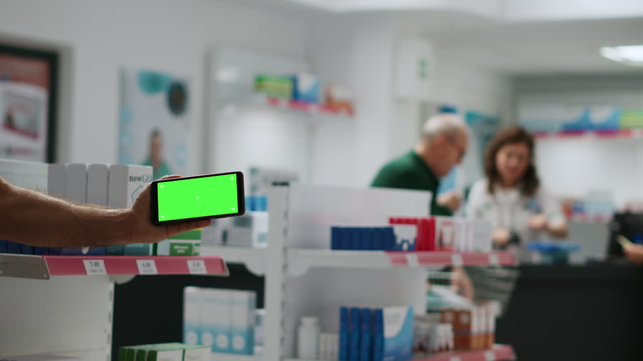 A phone with green screen in a pharmacy
