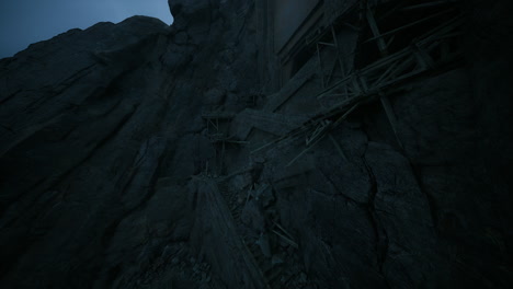 abandoned construction site on a rocky cliff during twilight hours