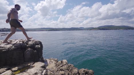 Jumping-into-the-sea-in-slow-motion.