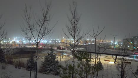 salt and plow trucks keep roads safe on a cold snowy night in montreal, quebec, canada