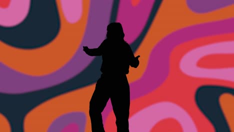 studio silhouette of woman dancing against multi coloured pattern background 1