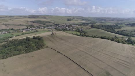 Aerial-tracking-from-right-to-left-high-above-the-Chapel-of-St-Catherine's-in-the-heart-of-Dorset,-near-the-village-of-Abbotsbury