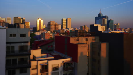 Golden-Sunrise-Shining-On-The-City-And-Residential-Buildings-In-Benito-Juarez,-Mexico