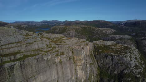Preikestolen Pulpit Rock seen from above with Lysefjord curving through the Norwegian highlands.