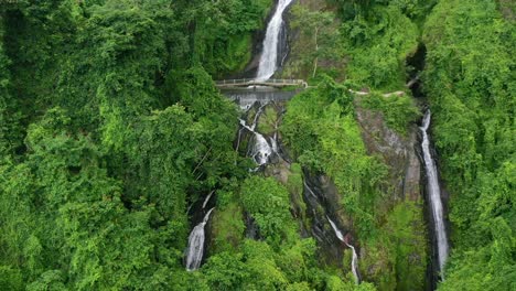 many waterfalls flowing through the jungle at kerta gangga in lombok indonesia, aerial