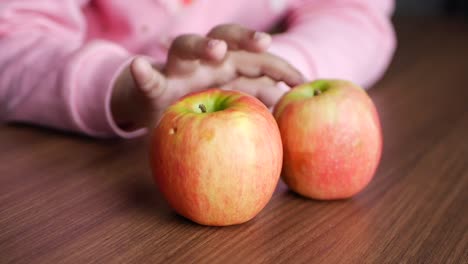 child holding apples