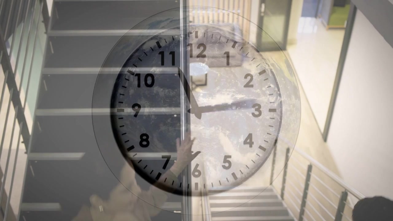 Two women stepping down office stairs, clock overlay shifting, holding railing and heading to foyer