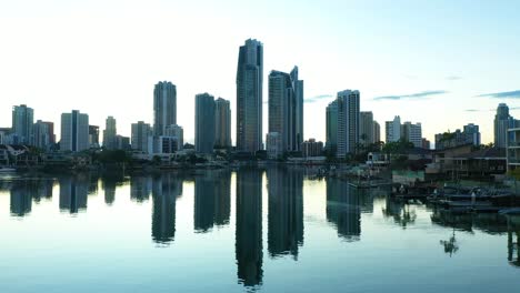 Sunrise-across-still-canal-waters,-Surfers-Paradise,Gold-Coast