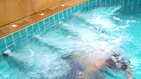 a man relaxes in the hot tub