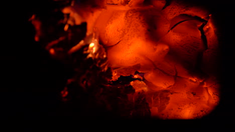 Beautiful-hot-burning-embers-in-a-fireplace-sparking-and-moving