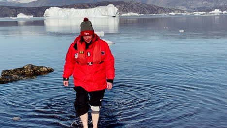 Woman-walking-in-the-water-in-the-arctic