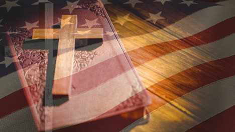 animation of crucifix and bible moving over american flag