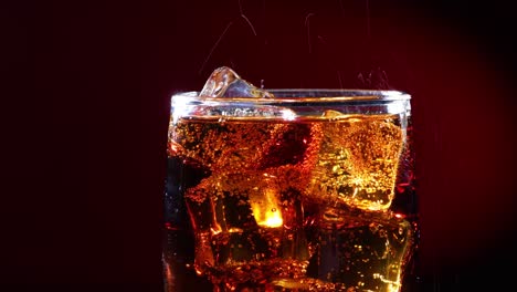 Cola-with-Ice-and-bubbles-in-glass.