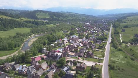 aerial view of the area of zakopane with tilt down to typical houses