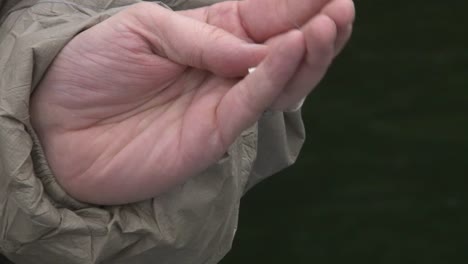 hand holding fish hook - close up