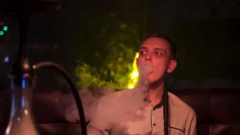 man smoking hookah