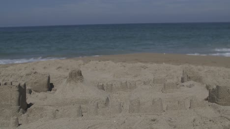 OBX-sand-castle-shore-ocean-medium-shot