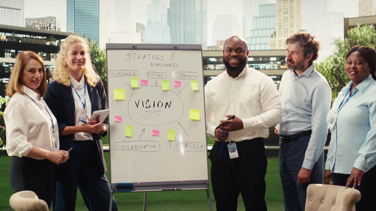 Portrait of diverse team reviewing strategic plan during outdoor workshop