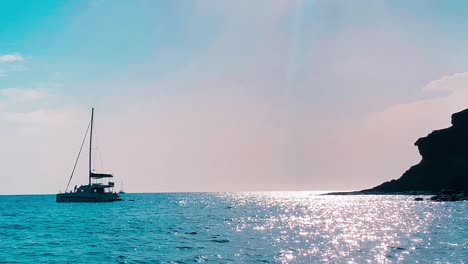 Boat-anchoring-in-a-cove-relaxing-in-sunset-slowmotion